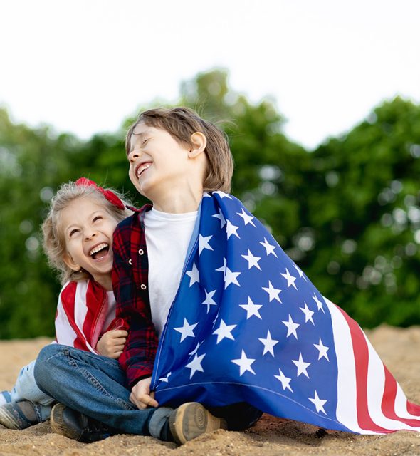 brother-and-sister-sit-on-the-shore-hiding-on-the-2023-11-27-05-26-33-utc